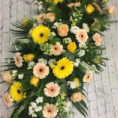 Classic peach, yellow and white casket spray